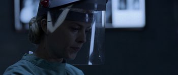 Movie still from “Halloween: Resurrection” (2002), directed by Rick Rosenthal – A person wearing a face shield and a green shirt; Close Up shot, Low angle