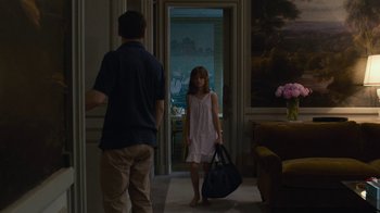 Movie still from “Happy End” (2017), directed by Michael Haneke – A man and a woman are walking in a room; Wide shot, Over the shoulder angle