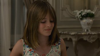 Movie still from “Happy End” (2017), directed by Michael Haneke – A young girl is sitting in a room; Close Up shot, Over the shoulder angle
