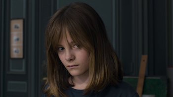 Movie still from “Happy End” (2017), directed by Michael Haneke – A young girl with long brown hair and blue eyes; Close Up shot, High angle