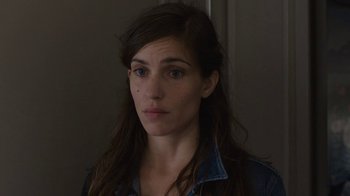 Movie still from “Happy End” (2017), directed by Michael Haneke – A person with long hair; Close Up shot, Over the shoulder angle