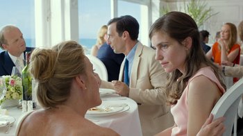 Movie still from “Happy End” (2017), directed by Michael Haneke – A man and a woman sitting at a dinner table; Medium shot, Over the shoulder angle
