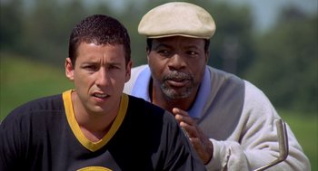 Movie still from “Happy Gilmore” (1996), directed by Dennis Dugan – A man and a boy are standing together; Close Up shot, Over the shoulder angle