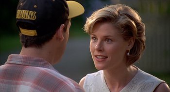 Movie still from “Happy Gilmore” (1996), directed by Dennis Dugan – A man and a woman talking to each other; Close Up shot, Over the shoulder angle