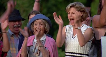 Movie still from “Happy Gilmore” (1996), directed by Dennis Dugan – A group of people that are standing up together; Medium shot, Low angle