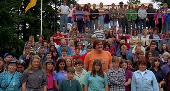 Movie still from “Happy Gilmore” (1996), directed by Dennis Dugan – A large group of people standing in front of each other; Wide shot, High angle