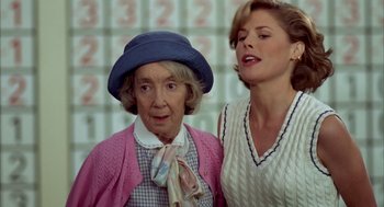 Movie still from “Happy Gilmore” (1996), directed by Dennis Dugan – A woman and an older woman standing next to each other; Close Up shot, Over the shoulder angle
