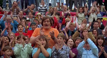 Movie still from “Happy Gilmore” (1996), directed by Dennis Dugan – A group of people sitting in front of each other; Medium shot, High angle