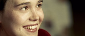 Movie still from “Hard Candy” (2005), directed by David Slade – A woman's face with white teeth; Extreme Close Up shot, High angle