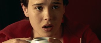 Movie still from “Hard Candy” (2005), directed by David Slade – A person holding a cup of coffee; Extreme Close Up shot, High angle