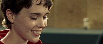 Movie still from “Hard Candy” (2005), directed by David Slade – A person smiling; Extreme Close Up shot, Over the shoulder angle