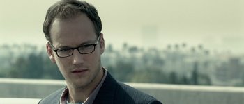 Movie still from “Hard Candy” (2005), directed by David Slade – A person wearing glasses and a suit; Close Up shot, Over the shoulder angle