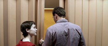 Movie still from “Hard Candy” (2005), directed by David Slade – A man and a boy standing in front of a door; Medium shot, Over the shoulder angle