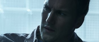 Movie still from “Hard Candy” (2005), directed by David Slade – A man's face in a dark room; Close Up shot, Low angle