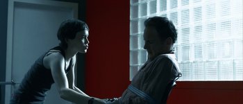 Movie still from “Hard Candy” (2005), directed by David Slade – A man and a woman are talking in a room; Medium shot, Over the shoulder angle
