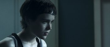 Movie still from “Hard Candy” (2005), directed by David Slade – A young boy is looking into the distance; Close Up shot, Over the shoulder angle