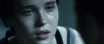 Movie still from “Hard Candy” (2005), directed by David Slade – A young woman's face with tears in her eyes; Extreme Close Up shot, Over the shoulder angle