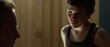 Movie still from “Hard Candy” (2005), directed by David Slade – A young woman is looking into the distance; Close Up shot, Over the shoulder angle