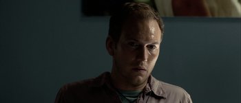 Movie still from “Hard Candy” (2005), directed by David Slade – A person wearing a brown shirt; Close Up shot, Low angle