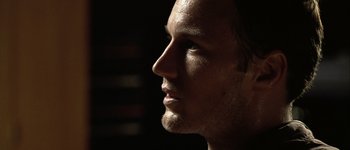 Movie still from “Hard Candy” (2005), directed by David Slade – A person's face in the dark; Close Up shot, Low angle