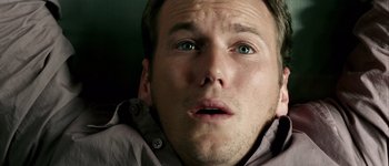 Movie still from “Hard Candy” (2005), directed by David Slade – A man's face with green eyes; Close Up shot, Overhead angle