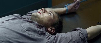 Movie still from “Hard Candy” (2005), directed by David Slade – A person laying on a table; Close Up shot, High angle