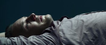 Movie still from “Hard Candy” (2005), directed by David Slade – A person laying on their stomach; Close Up shot, Overhead angle