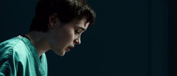 Movie still from “Hard Candy” (2005), directed by David Slade – A young woman with a head injury looking to the side; Close Up shot, Low angle