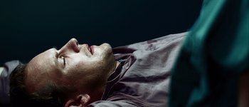Movie still from “Hard Candy” (2005), directed by David Slade – A person laying on their stomach; Close Up shot, High angle