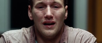 Movie still from “Hard Candy” (2005), directed by David Slade – A person crying with his eyes closed; Close Up shot, Overhead angle