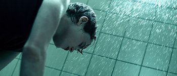 Movie still from “Hard Candy” (2005), directed by David Slade – A man with blue hair in a swimming pool; Extreme Close Up shot, Overhead angle