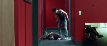 Movie still from “Hard Candy” (2005), directed by David Slade – A woman standing over a man laying on the ground; Wide shot, Overhead angle