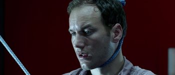 Movie still from “Hard Candy” (2005), directed by David Slade – A person wearing a neck tie; Close Up shot, High angle