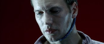 Movie still from “Hard Candy” (2005), directed by David Slade – A man's face with water on his face; Close Up shot, High angle