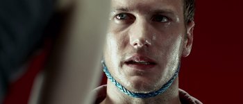 Movie still from “Hard Candy” (2005), directed by David Slade – A person wearing a blue necklace; Extreme Close Up shot, Over the shoulder angle