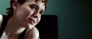 Movie still from “Hard Candy” (2005), directed by David Slade – A person with a bruised face; Close Up shot, Over the shoulder angle