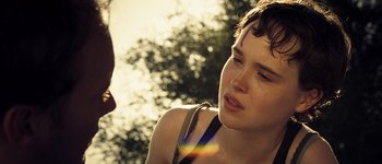 Movie still from “Hard Candy” (2005), directed by David Slade – A young woman is looking down at the ground; Close Up shot, Over the shoulder angle