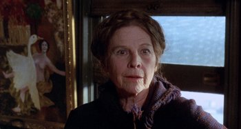 Movie still from “Harold and Maude” (1971), directed by Hal Ashby – An older woman wearing a sweater and a scarf; Close Up shot, Over the shoulder angle