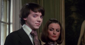 Movie still from “Harold and Maude” (1971), directed by Hal Ashby – A man and a woman standing next to each other; Close Up shot, Low angle