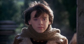 Movie still from “Harold and Maude” (1971), directed by Hal Ashby – A young man wearing a sweater and a scarf; Close Up shot, Low angle