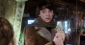 Movie still from “Harold and Maude” (1971), directed by Hal Ashby – A young man holding a pair of scissors in his hand; Close Up shot, Low angle