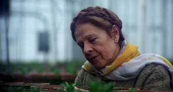 Movie still from “Harold and Maude” (1971), directed by Hal Ashby – An older woman wearing a yellow neck scarf; Close Up shot, Low angle