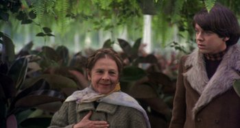 Movie still from “Harold and Maude” (1971), directed by Hal Ashby – An older woman with a scarf around her neck; Close Up shot, Over the shoulder angle