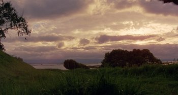 Movie still from “Harold and Maude” (1971), directed by Hal Ashby – A view of a body of water and a cloudy sky; Extreme Wide shot, Low angle