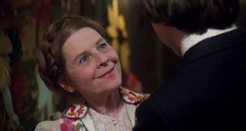 Movie still from “Harold and Maude” (1971), directed by Hal Ashby – An older woman smiling at a young man; Close Up shot, Over the shoulder angle