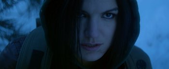 Movie still from “Haywire” (2011), directed by Steven Soderbergh – A person with long hair; Close Up shot, Low angle