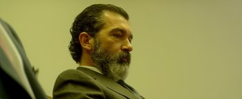 Movie still from “Haywire” (2011), directed by Steven Soderbergh – A man in a suit and a beard; Close Up shot, Low angle