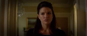 Movie still from “Haywire” (2011), directed by Steven Soderbergh – A person with long hair; Close Up shot, Over the shoulder angle