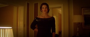 Movie still from “Haywire” (2011), directed by Steven Soderbergh – A woman standing in a room with her hands on her hips; Medium shot, Low angle