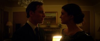 Movie still from “Haywire” (2011), directed by Steven Soderbergh – A man and a woman standing next to each other in a room; Close Up shot, Low angle